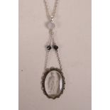 A white metal mounted glass intaglio seal pendant necklace, 2½" drop