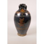 A Chinese Cizhou kiln pottery vase decorated with Chinese characters, 10½" high
