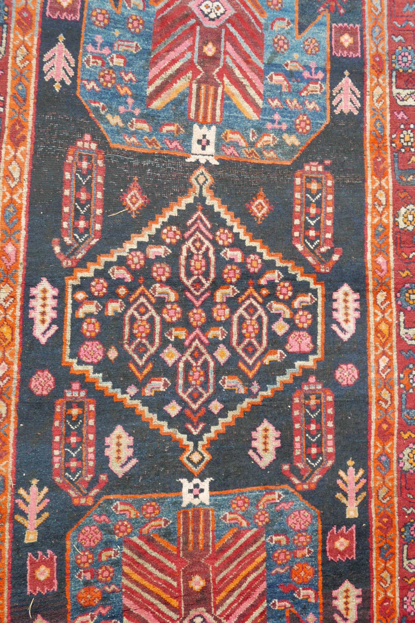 A red and blue ground Persian wool runner decorated with stylised birds and medallions, 46½" x 98" - Image 6 of 12