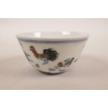 A Chinese doucai porcelain tea bowl with chicken decoration, seal mark to base, 3" diameter