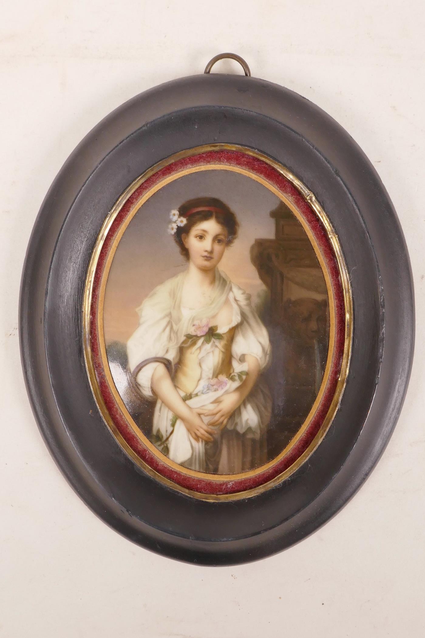 A Victorian hand painted porcelain portrait plaque of a lady in front of a fountain, 3½" x 4½"