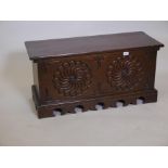 A carved oak coffer on a shaped plinth base. 14½" x 37", 18" high