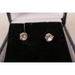 A pair of white gold and diamond stud earrings, approximately 86 points