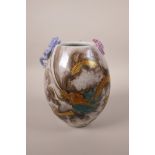 A Chinese polychrome porcelain vase with applied dragon and bat decoration to the lip and red and