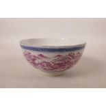 A Chinese porcelain rice bowl decorated with a puce riverside landscape scene, seal mark to base, 5"