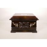 A Chinese hardwood box with a sliding top and mother of pearl inlaid dragon decoration, 13" x 9"