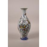 A Chinese doucai porcelain vase decorated with a fruiting peach tree and bats, 6 character mark to