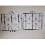 A pair of wrought iron gates, 89" wide including hinges, 30" x 24" diameter