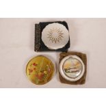 Three vintage powder compacts, a Stratton Starburst brushed metal, an American one depicting the