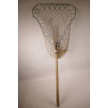 A vintage wooden handled folding landing net with aluminium frame, 37" long