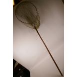 A Hardy Bros wood handled folding landing net, 43" long