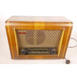 A 1950s walnut cased valve radio by Pye, the case decorated with boxwood stringing, 12½" high, 16"