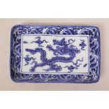 A Chinese blue and white porcelain trinket dish with dragon decoration, 8" x 5"