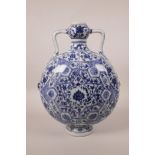A Chinese blue and white porcelain two handled flask decorated with a stylised lotus flower pattern,