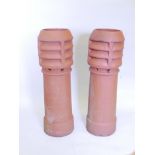 A pair of terracotta chimney pots, 42" high