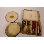 A small vintage lure box, 4¼" x 3" x 1", containing various lures, together with a round Chas Farlow