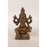 An Indian bronze of a many armed deity, 4½" high