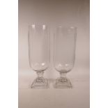 A pair of large glass hurricane vases, 16" high