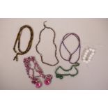 A quantity of costume jewellery necklaces to include jade, agate, hardstone etc