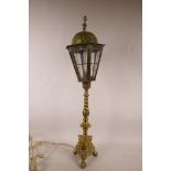 A brass table lamp in the form of a street lamp, 25½" high