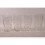 A collection of four etched high ball glasses decorated with portraits of Churchill, Montgomery,
