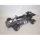 A child's retro plastic pedal racing car, 40" x 24"