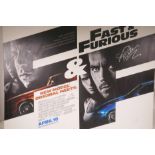 A 'Fast and Furious' (4) mounted film poster, signed by Paul Walker and Vin Diesel, 40" x 30"
