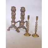 A pair of brass andirons, 17" high, and a pair of C19th brass twist candlesticks