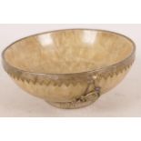 A Chinese hardstone bowl with white metal mount decorated with dragons, 4¼" diameter