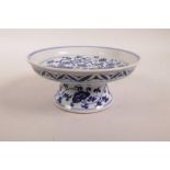 A Chinese blue and white stem dish with scrolling lotus flower and phoenix decoration, 6 character