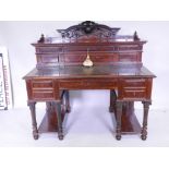 A fine quality C19th Continental amboyna kneehole desk, the upper section with six moulded front