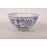 A Chinese blue and white porcelain rice bowl decorated with deer and peach trees, 6 character mark