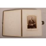 A Victorian leather bound photograph album, 9" x 12"