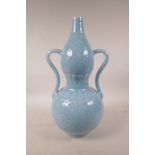 A Chinese blue glazed porcelain double gourd vase with two handles and underglaze lotus flower