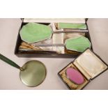 A boxed 1930s enamelled dressing table set together with a similar folding hand mirror and a small