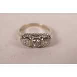 An 18ct white gold Art Deco three stone diamond ring, approximate size 'K/L'