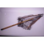 A vintage Hardy Bros. bamboo and brass folding landing net, net A/F, 48" long