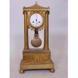 A C19th French Empire style ormolu portico mantel clock, with pagoda top and four columns on a