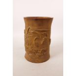 A Chinese carved bamboo brush pot decorated with carp in a lotus pond, 7" high