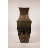 A large Chinese olive green ground vase with two mask handles, with raised gilt decoration,