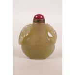 A Chinese carved jade snuff bottle with two kylin handles, 2" high