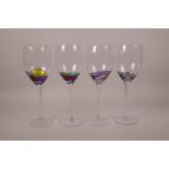 Four wine glasses with polychrome swirl decoration, 9" high