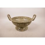 A Chinese mixed metal censer with two handles, archaic style decoration and character