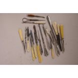 A collection of button hooks and manicure tools with silver plated mother of pearl and bone handles,