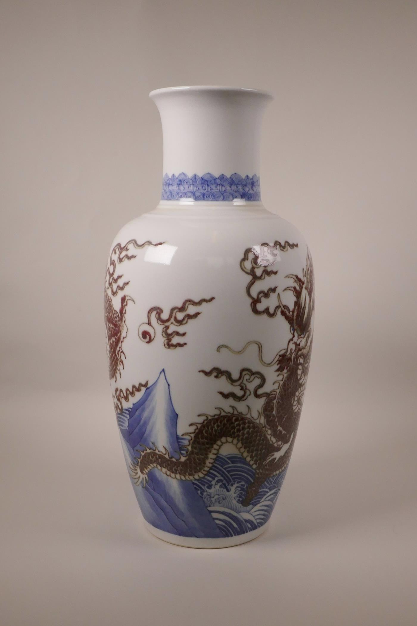 A large Chinese blue and white porcelain vase decorated with a red dragon chasing the flaming pearl, - Image 3 of 10
