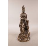 A Sino-Tibetan filled white metal figure of Quan Yin, double vajra mark to base, 9½" high