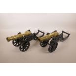 A pair of Victorian brass table cannons, 17½" long
