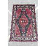 A red ground full pile Afghan Baluch tribal rug, 47" x 73"