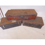Three vintage tin trunks, one with name plaque WG Parker RM, lined with 1915 newspaper, largest 41½"