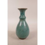 A Chinese turquoise glazed pottery vase with speckle decoration to glaze, 5½" high